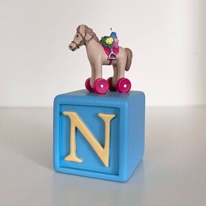Wooden Horse Toy on Blue Block